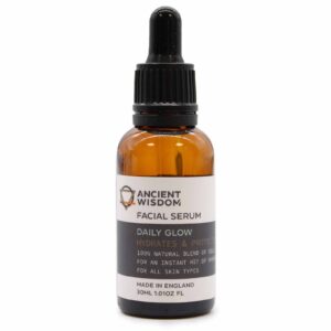 Daily Glow facial serum in a brown bottle with a black dropper cap.