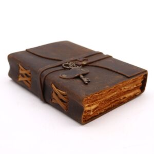 Potion-kissed Oiled Leather & Key – 200 pages decle-edged – 13x18cm | Grimoires | Niffty Witchy Supplies UK in Grimoires style, enchanting grimo