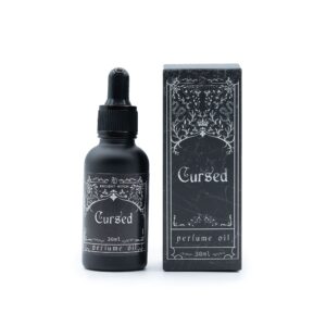 Cursed perfume oil in a black dropper bottle beside its matching box.