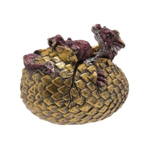 Fang purple dragon figurine emerging from a gold-coloured egg.
